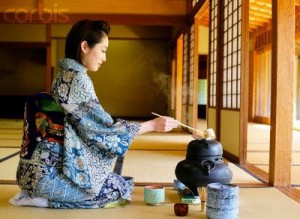 Japanese Woman in a Kimono Making Tea --- Image by © Bloomimage/Corbis